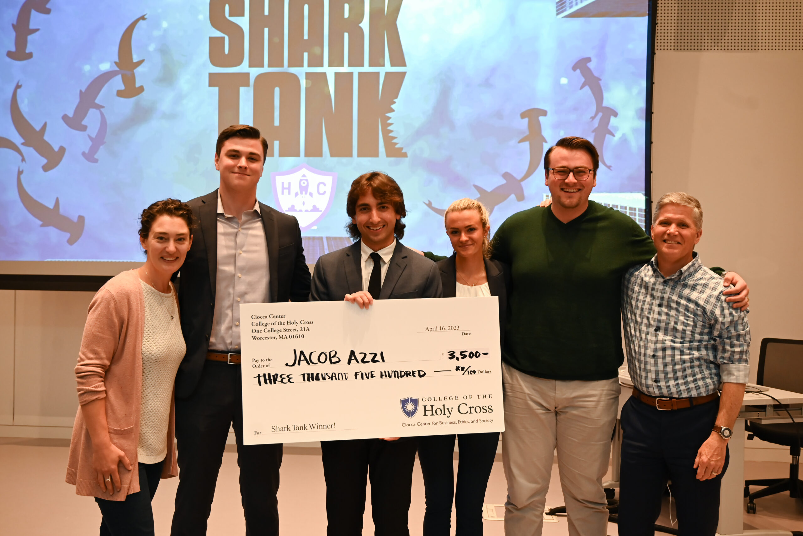 Shark Tanke winner holding large check